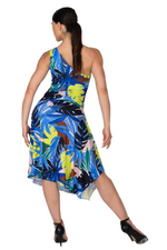 Load image into Gallery viewer, Woman wearing a colorful dress with a tropical leaf pattern on a white background