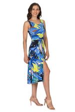 Load image into Gallery viewer, Woman wearing a colorful tropical print dress on a white background