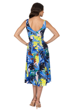 Load image into Gallery viewer, Woman wearing a colorful one-shoulder dress with a leaf pattern on a white background