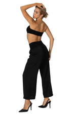 Load image into Gallery viewer, Woman wearing a black one-shoulder top and wide-leg pants on a white background
