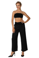 Load image into Gallery viewer, Woman wearing a black strapless top and wide-leg pants on a white background