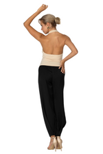 Load image into Gallery viewer, Woman wearing a beige top and black pants on a white background