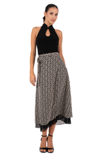 Load image into Gallery viewer, Woman wearing a black halter top and patterned skirt on a white background