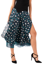 Load image into Gallery viewer, Woman wearing a patterned skirt with a high slit on a white background