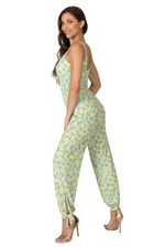 Load image into Gallery viewer, Woman wearing a floral jumpsuit on a white background