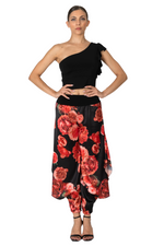 Load image into Gallery viewer, Woman wearing a black one-shoulder top and red floral skirt on a white background