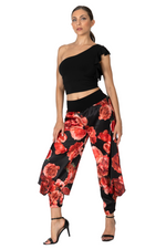 Load image into Gallery viewer, Woman wearing a black one-shoulder top and floral pants on a white background