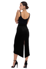 Load image into Gallery viewer, Woman wearing a black dress with a slit on a white background