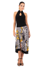 Load image into Gallery viewer, Woman wearing a black halter top and patterned skirt on a white background