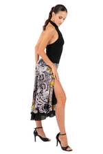 Load image into Gallery viewer, Woman wearing a black top and patterned skirt on a white background