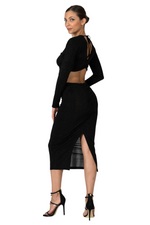 Load image into Gallery viewer, Woman wearing a black dress with cut-out design on a white background