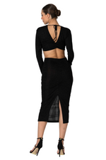 Load image into Gallery viewer, Black dress with open back and sheer side panels worn by a model on a white background