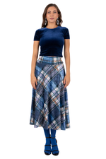 Load image into Gallery viewer, Woman wearing a blue top and plaid skirt on a white background
