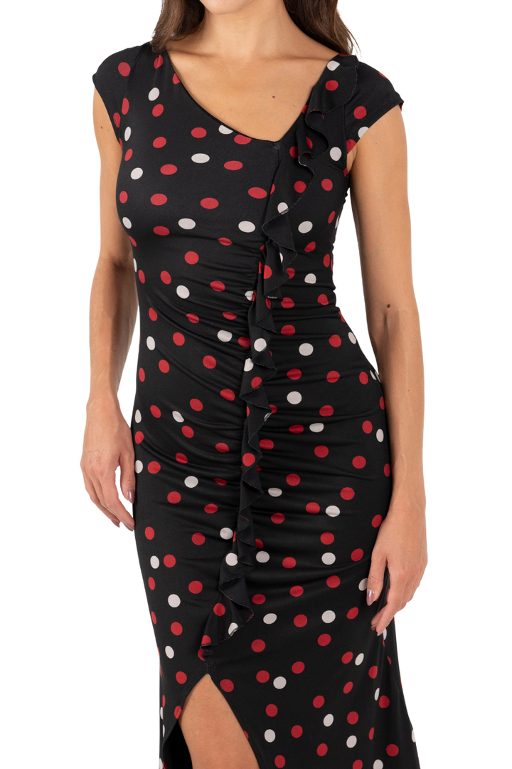 Black dress with red and white polka dots on a white background
