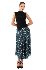 Load image into Gallery viewer, Woman wearing a black sleeveless top and a long, patterned skirt on a white background
