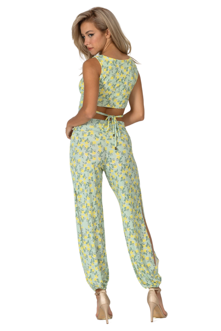 Woman wearing a floral two-piece outfit on a white background