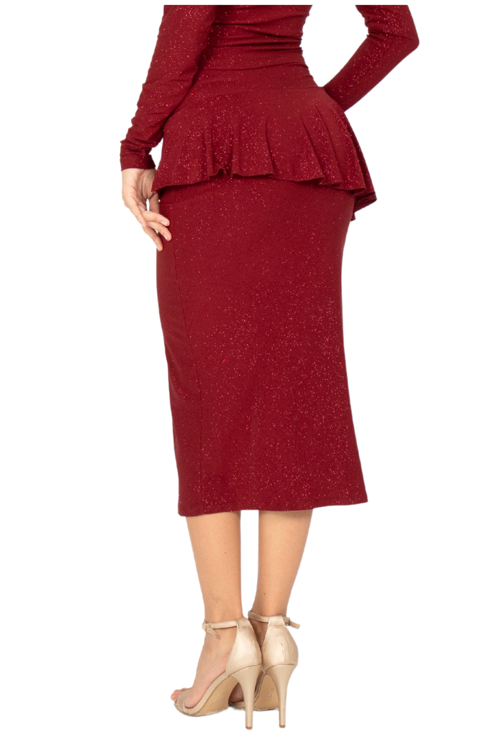 Red peplum top and pencil skirt with beige high heels on a white background