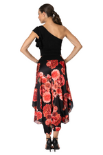 Load image into Gallery viewer, Woman wearing a black one-shoulder dress with red floral pattern on a white background
